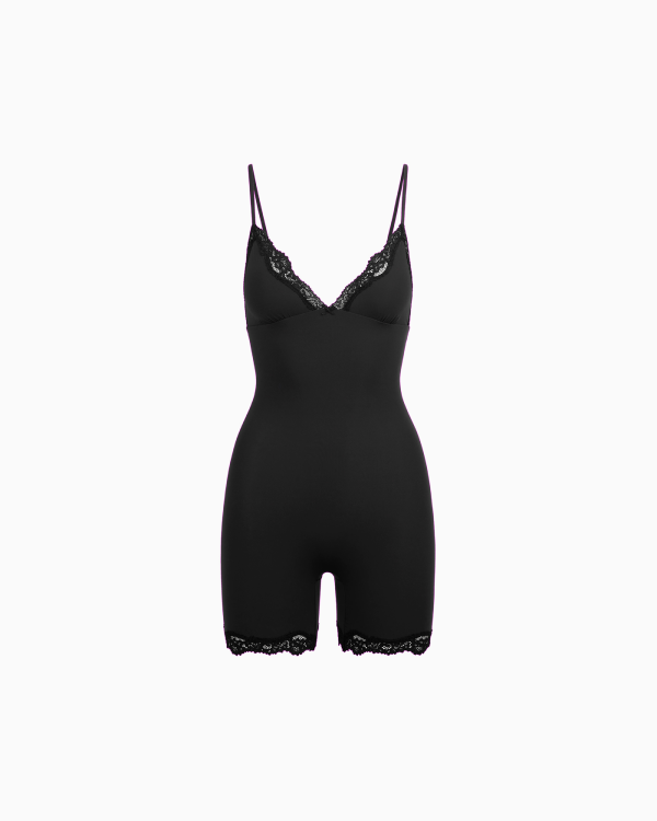 A MODEL POSES WEARING SKIMS CATSUITS & ONESIES