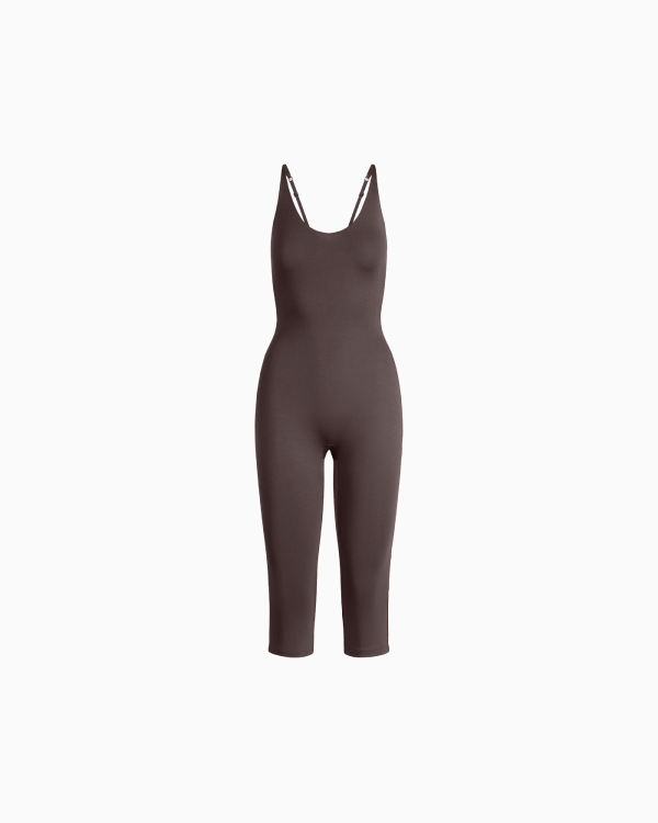 A MODEL POSES WEARING SKIMS LEGGINGS & PANTS